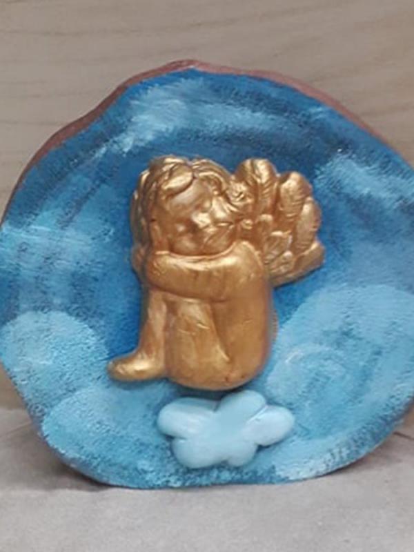 Αγγελάκι στα σύννεφα